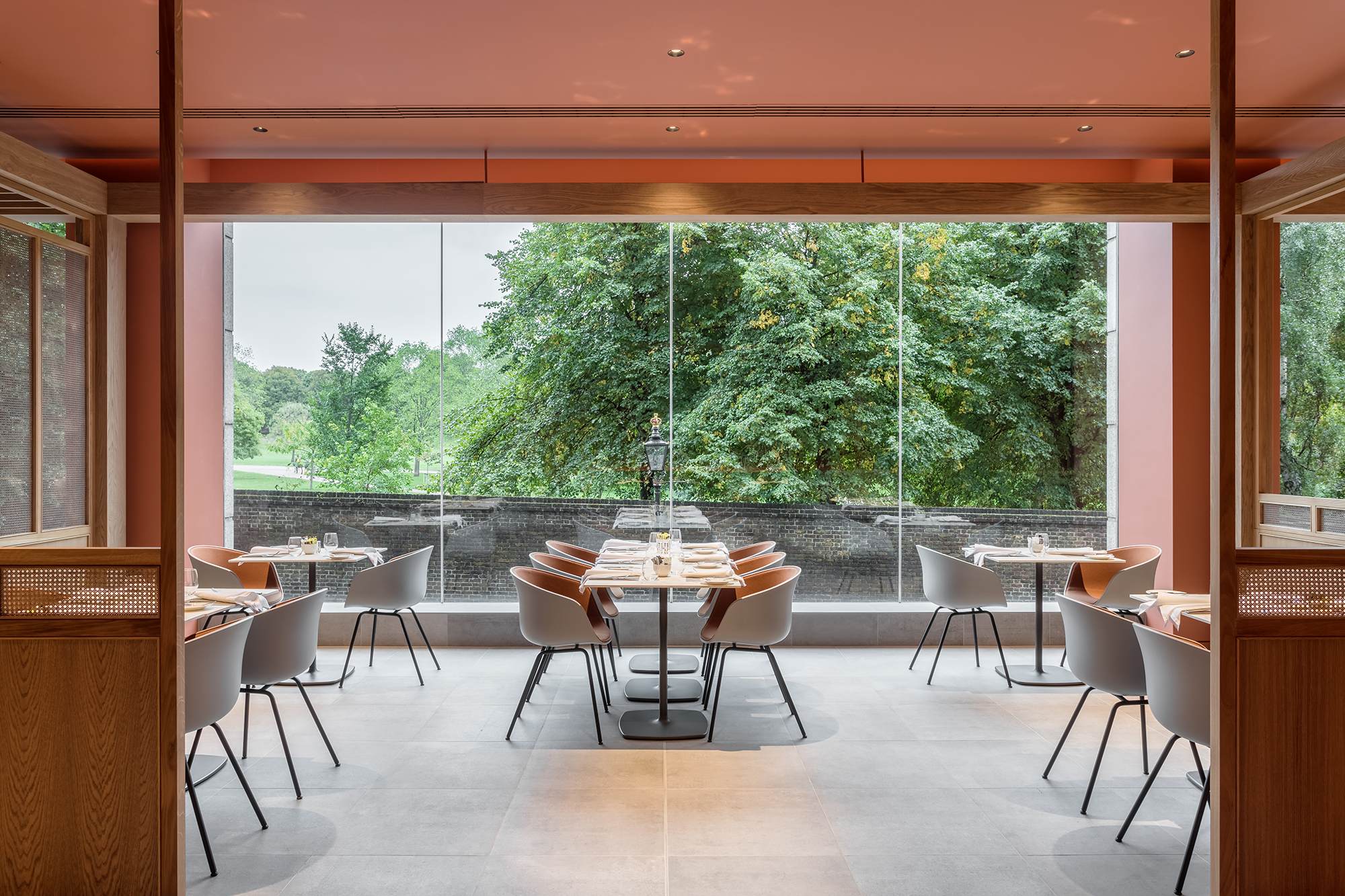 HAY AAC25 chair with front upholstery and Pedrali tables in Origin Restaurant, with view over Kensington Gardens.